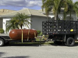 Propane tank for an underground auxiliary generator waiting to be installed underground at a home.